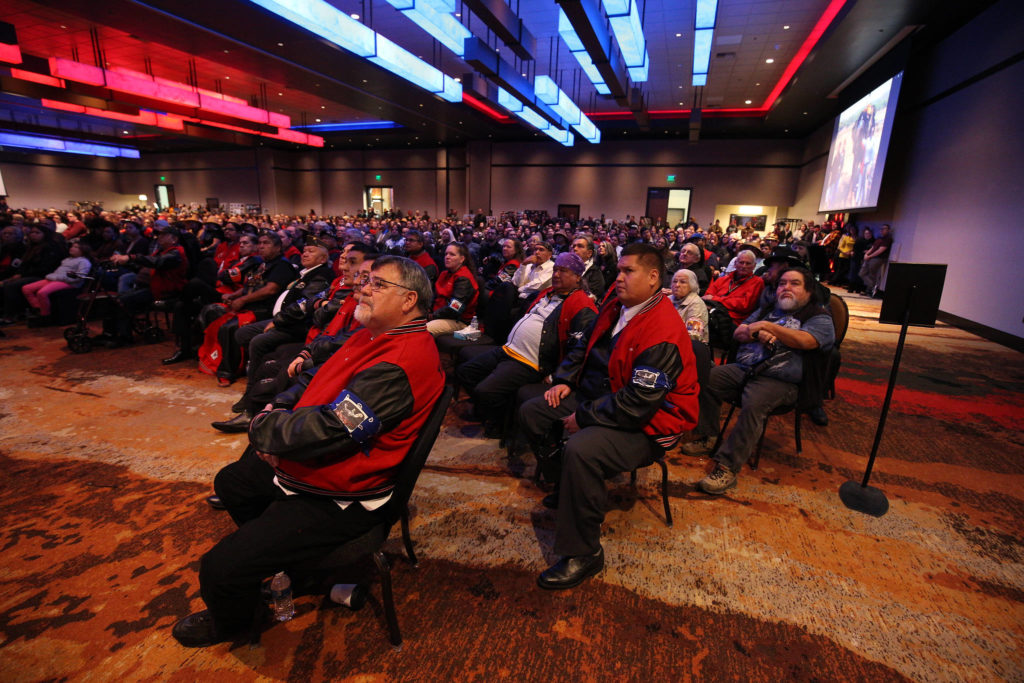 In was standing room only as family and guests watch a video showing the life of Tulalip Tribes’ longest serving board member and chairman Stan Jones Sr. on Tuesday in Tulalip. (Andy Bronson / The Herald)

