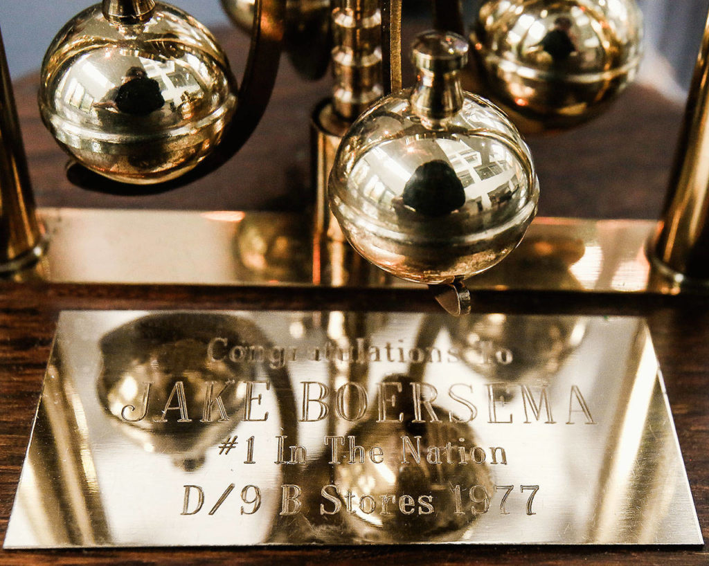 Jake Boersema’s name is engraved inside a clock presented to him in 1977 when his hardware department at the Everett Mall Sears store was the company’s No.1 hardware department in the nation. (Dan Bates / The Herald)
