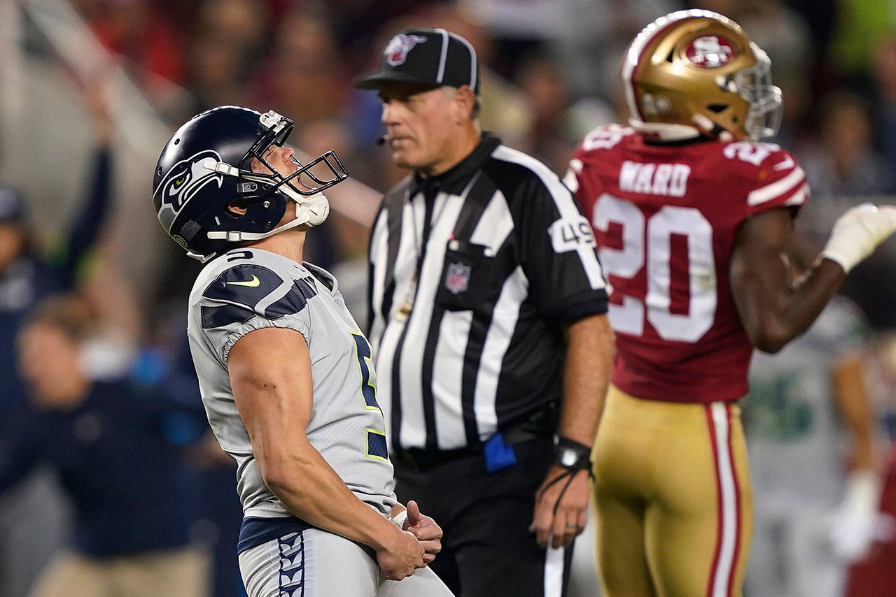 Seattle Seahawks kicker Jason Myers (left) celebrates after kicking the winning field goal during overtime of an NFL football game against the San Francisco 49ers in Santa Clara, Calif., Monday, Nov. 11, 2019. Seattle won 27-24. (AP Photo/Tony Avelar)