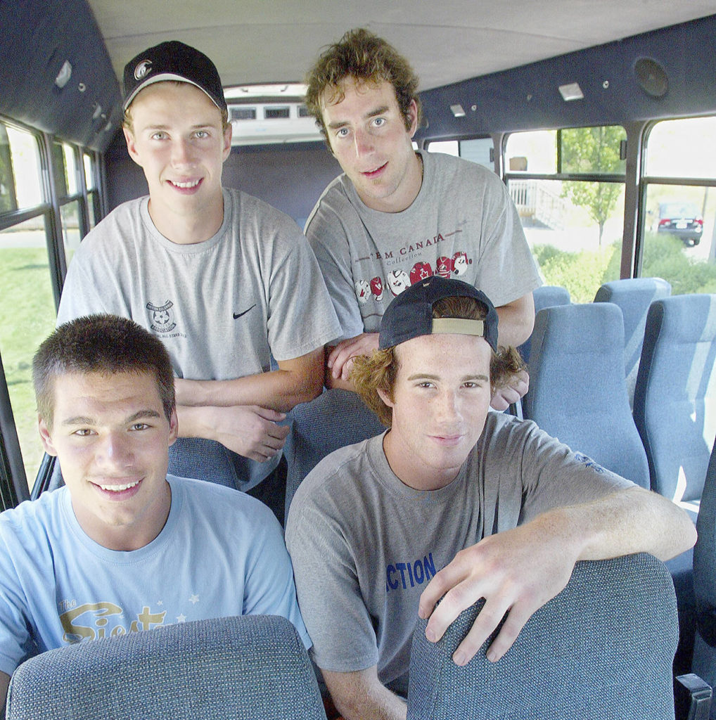 Mitch Love (top right) poses with teammates (clockwise from top left) Torrie Wheat, Jeff Harvey and Jovan Matic prior to the start of the Everett Silvertips’ inaugural season in 2003. (Michael O’Leary / The Herald)
