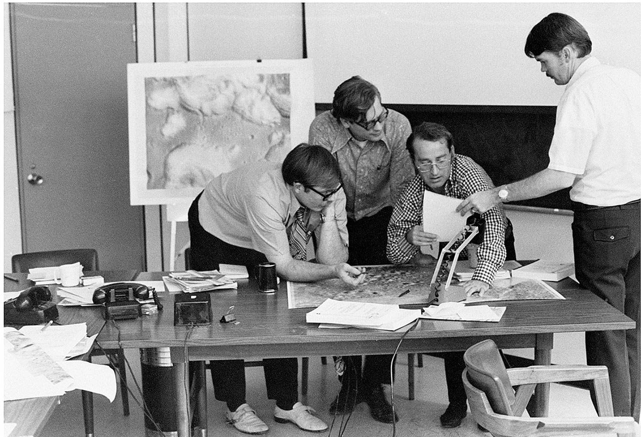 Grant Heiken (right) and other scientists discuss ideas at a NASA lab. (Grant Heiken)