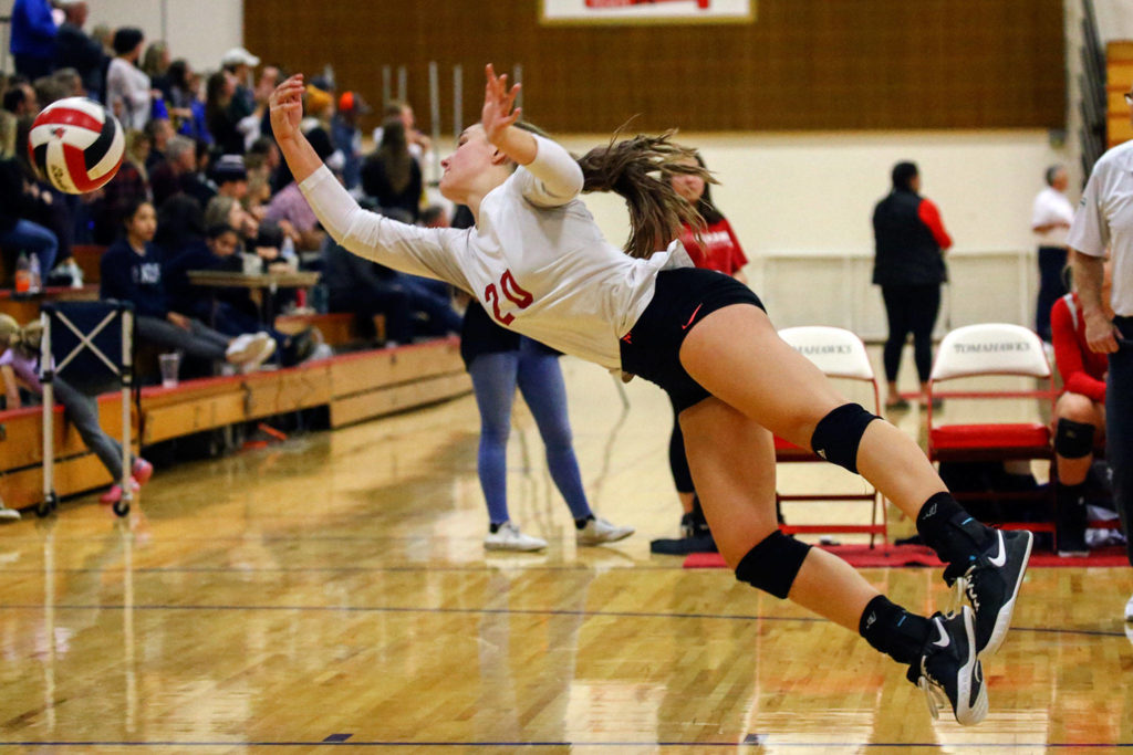 Snohomish’s Lauren Riske makes a dive against Oak Harbor Thursday evening at Marysville-Pilchuck High School on November 14, 2019. Snohomish won in straight sets. (Kevin Clark / The Herald)
