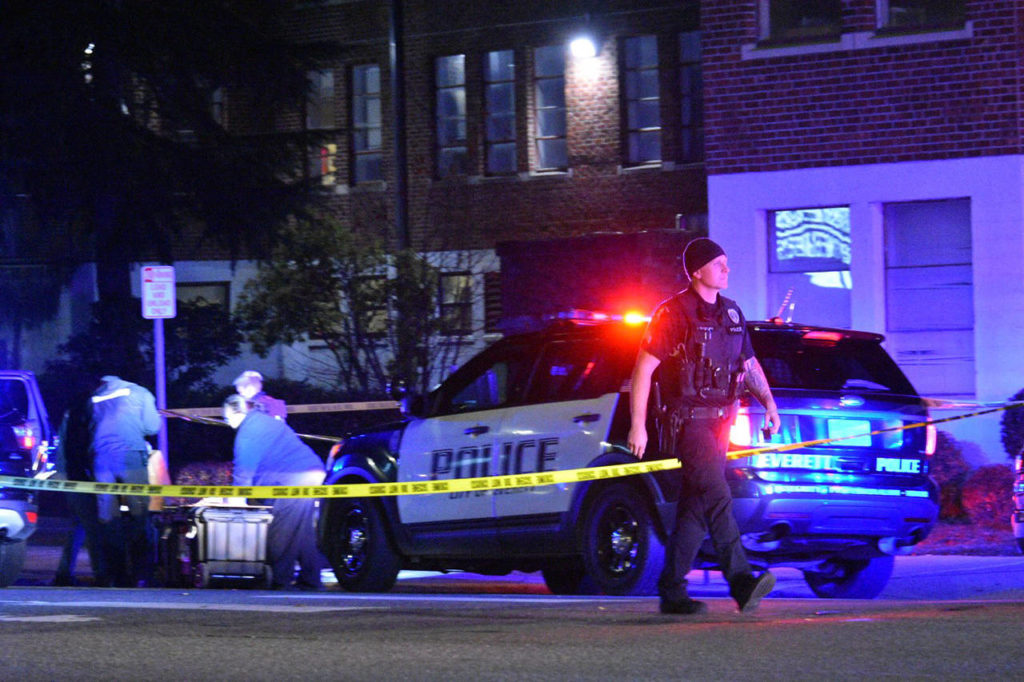 Police investigate after an officer used force while detaining a man Thursday evening at Broadway and 33rd Street in Everett. (Caleb Hutton / The Herald)
