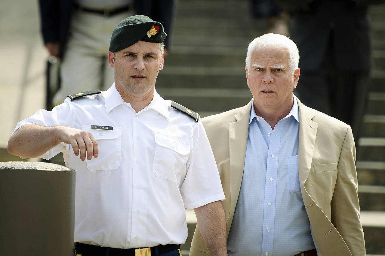 In this June 27 photo, Maj. Mathew Golsteyn (left), a former Army Special Forces soldier, leaves the Fort Bragg courtroom facility with his civilian lawyer, Phillip Stackhouse (right) after an arraignment hearing. (Andrew Craft/The Fayetteville Observer via AP)