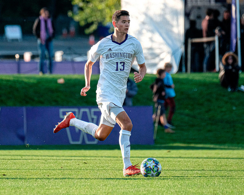 The University of Washington’s John Magnus dribbles upfield during a match earlier this season at Husky Soccer Stadium in Seattle. (University of Washington photo)
