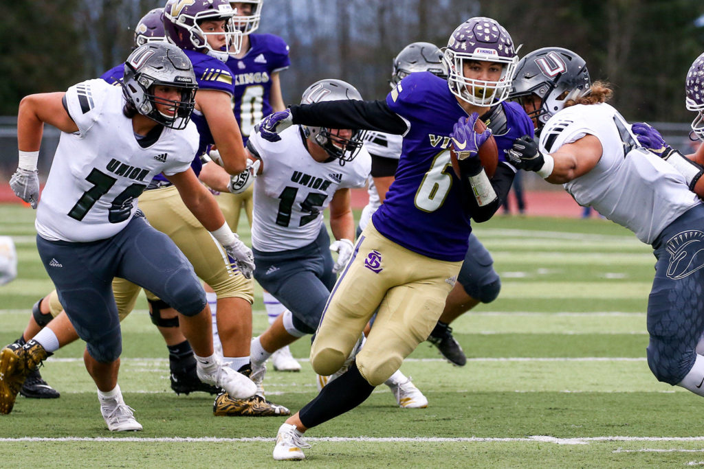 Lake Stevens’ Dallas Landeros rushes for yardage against Union Saturday afternoon at Lake Stevens High School on November 16, 2019. Lake Stevens won 28-21. (Kevin Clark / The Herald)
