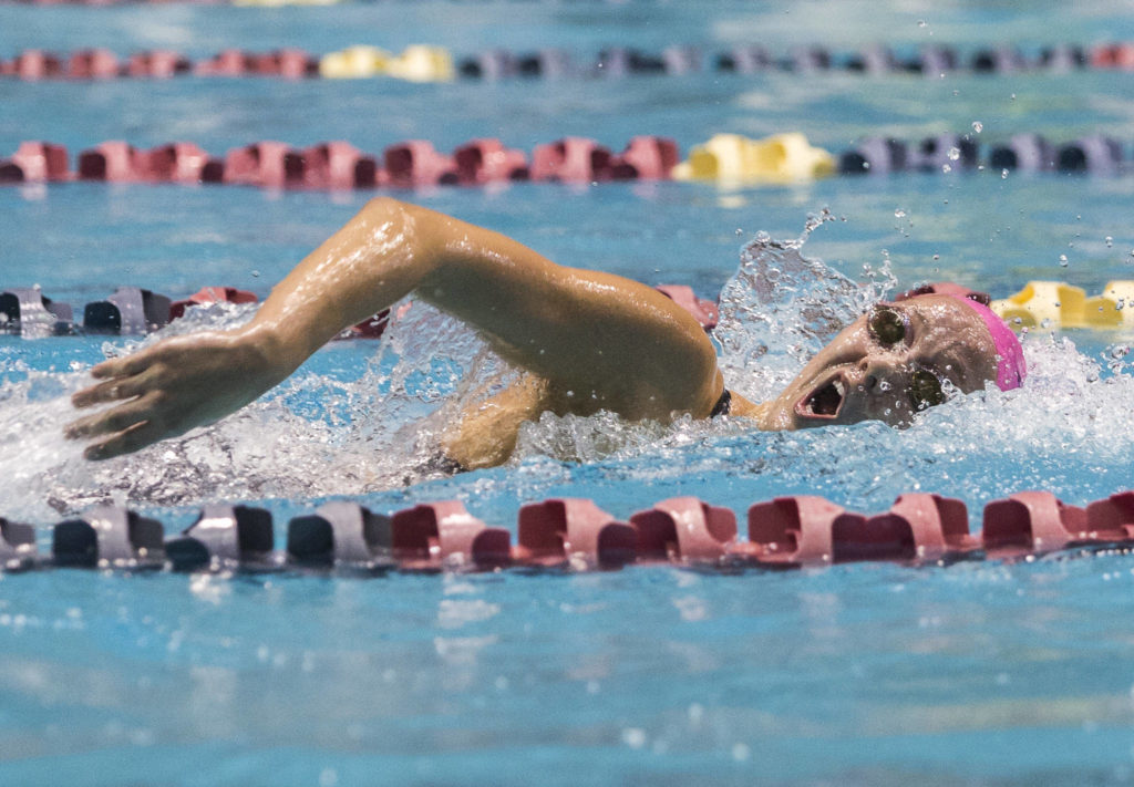 Kamiak’s Eli Straume competes in the 200 yard freestyle during the 2019 4A Girls State Swim and Dive Championship on Nov. 16, 2019 in Federal Way, Wash. (Olivia Vanni / The Herald)
