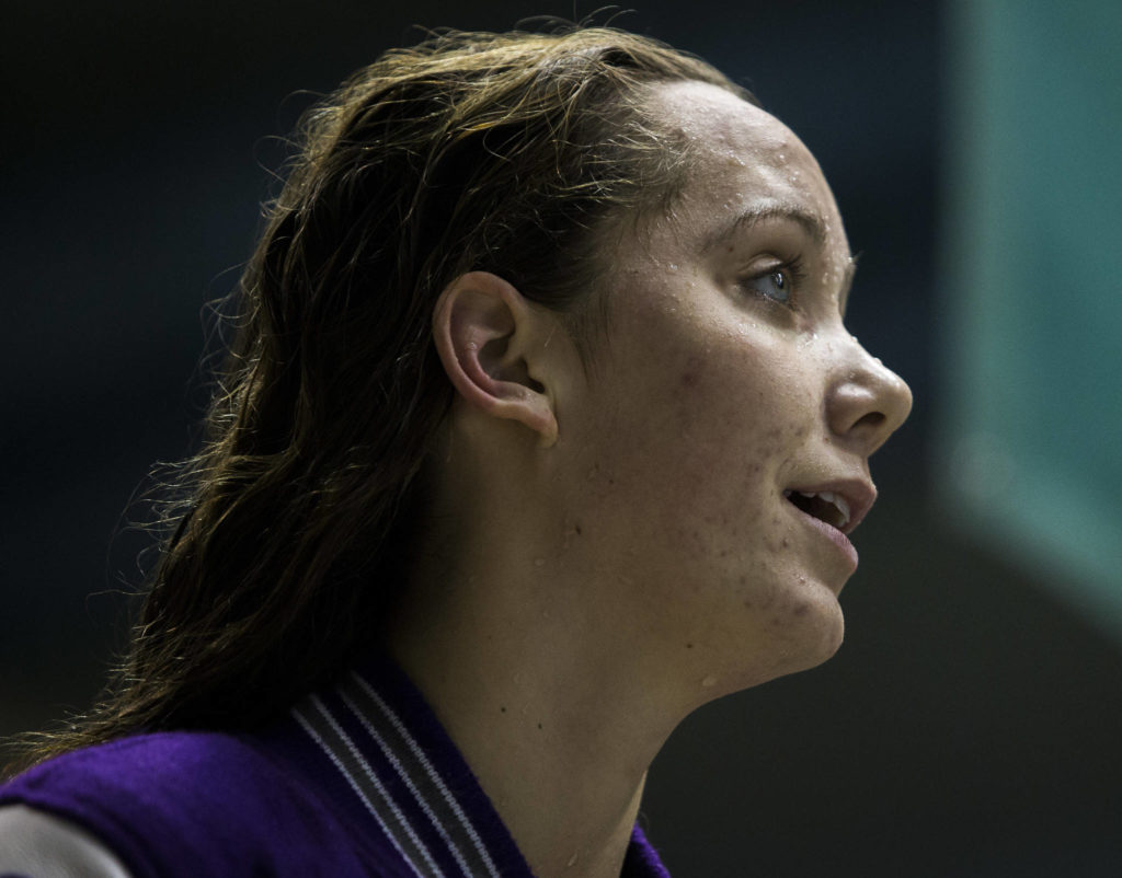 Kamiak’s Eli Straume smiles as she looks up at her time on the board during the 2019 4A Girls State Swim and Dive Championship on Nov. 16, 2019 in Federal Way, Wash. (Olivia Vanni / The Herald)
