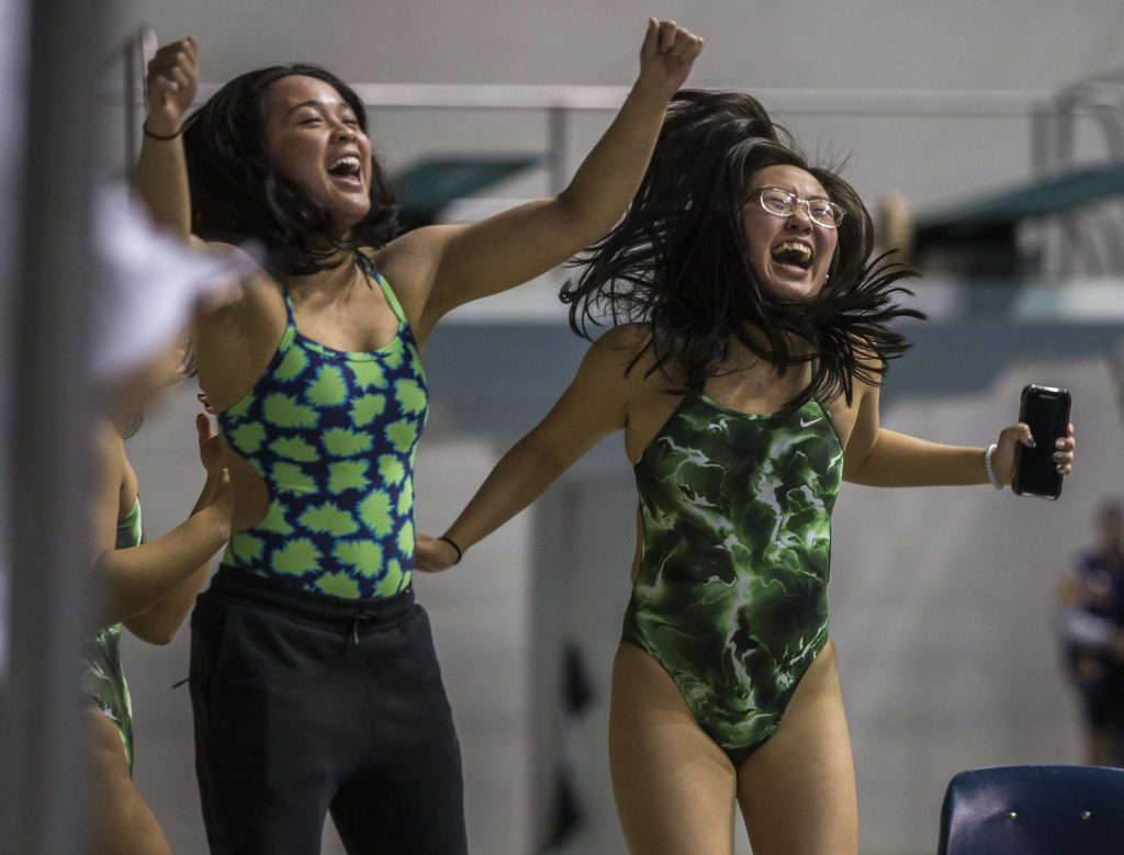 Jackson swimmers cheer on their teammates during the 2019 4A Girls State Swim and Dive Championship on Nov. 16, 2019 in Federal Way, Wash. (Olivia Vanni / The Herald)
