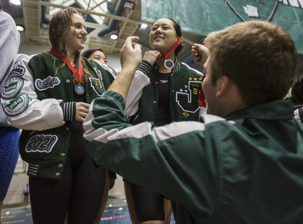 Members of Jackson’s 200 freestyle relay team receive their second-place medals. (Olivia Vanni / The Herald)
