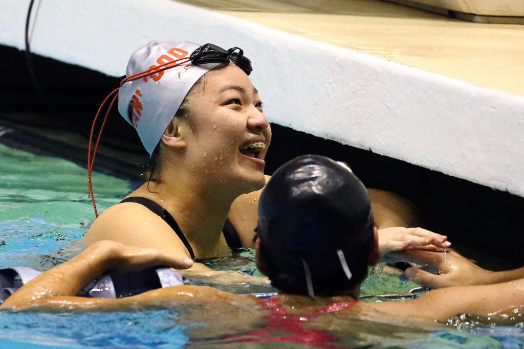 Stanwood senior Jetlynn Hau is all smiles after winning her second consecutive state title in the 100 breaststroke. (Kevin Clark / The Herald)
