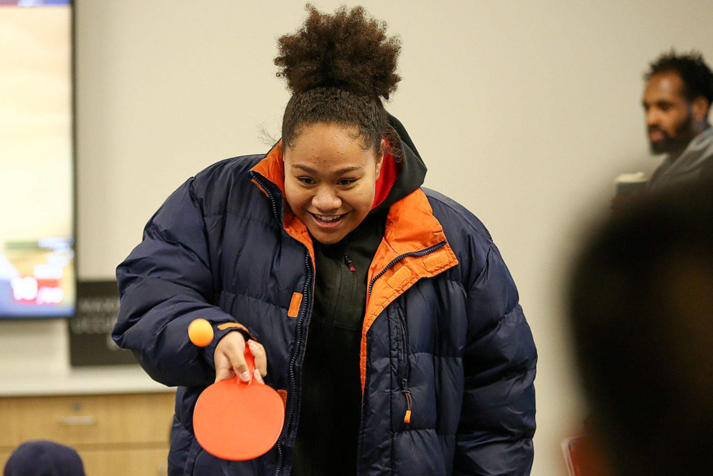 Anna Kunawave plays ping-pong in the soon-to-be opened Everett YMCA after the ribbon cutting ceremony Saturday morning. (Kevin Clark / The Herald)
