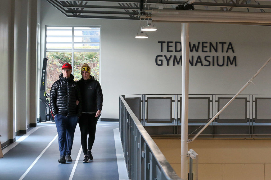 Guests tour the track of the soon-to-be opened Everett YMCA after the ribbon cutting ceremony Saturday. (Kevin Clark / The Herald)
