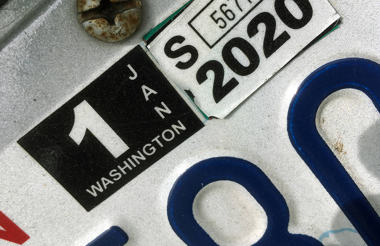 I-976 limits the annual vehicle registration fee for most passenger vehicles to $30. (Sue Misao / Herald file)