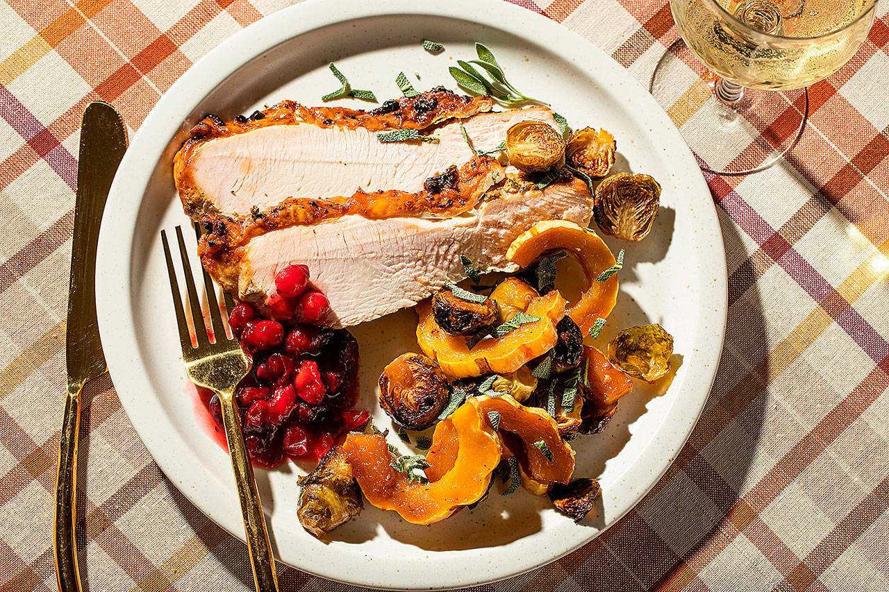 Herbed turkey breast with delicata squash and Brussels sprouts is a Thanksgiving meal for four made on a sheet pan. (Photo by Justin Tsucalas for the Washington Post)