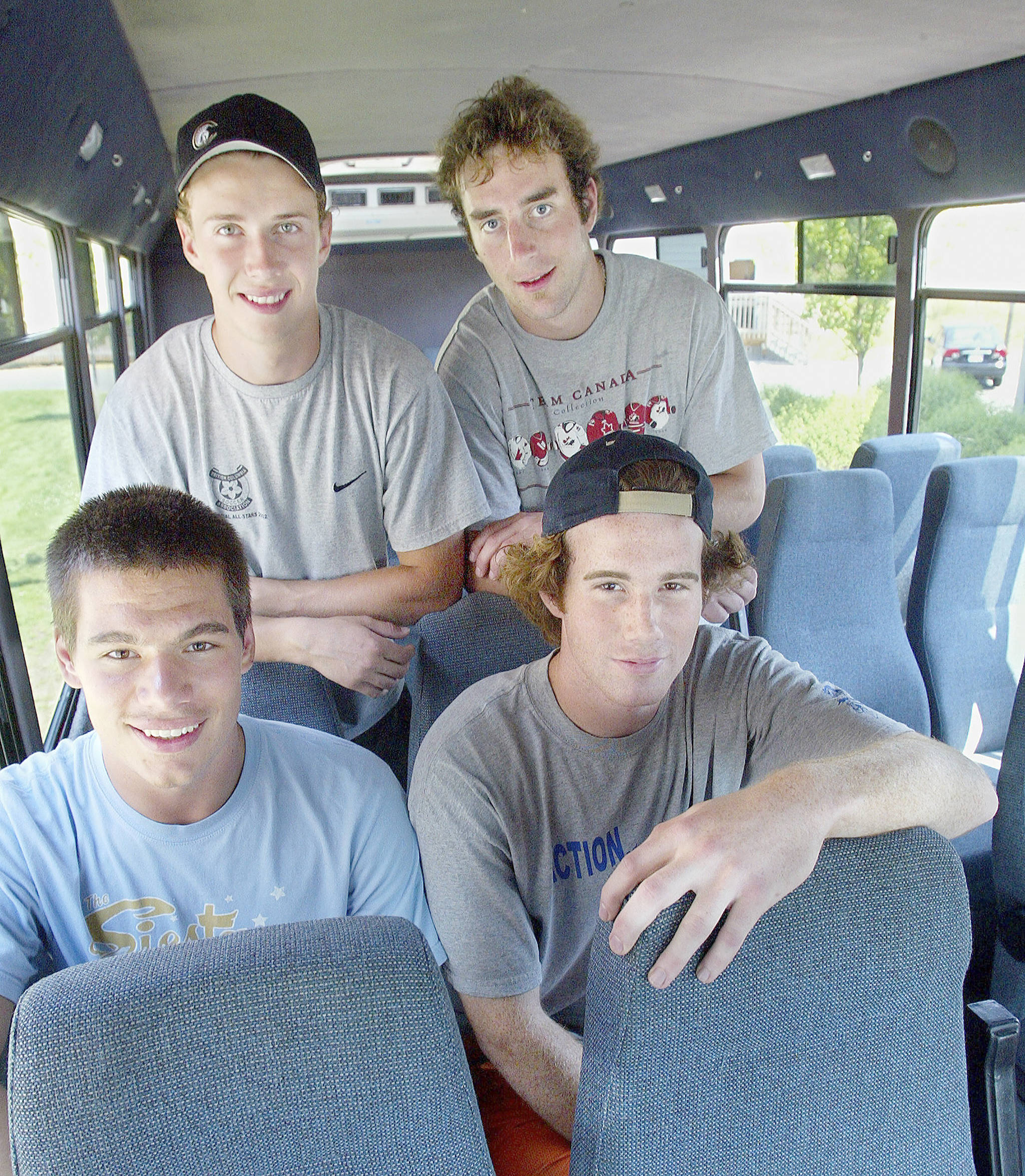 Mitch Love (top right) poses with teammates (clockwise from top left) Torie Wheat, Jeff Harvey and Jovan Matic prior to the start of the Everett Silvertips’ inaugural season in 2003. (Michael O’Leary / Herald file)