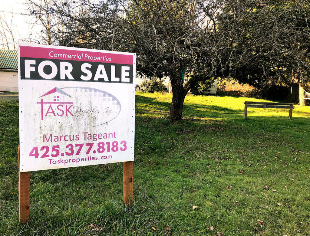 A real estate sign at the site of the proposed Lake Stevens Costco bears the name of Lake Stevens City Councilman Marcus Tageant. (Chuck Taylor / The Herald) 
