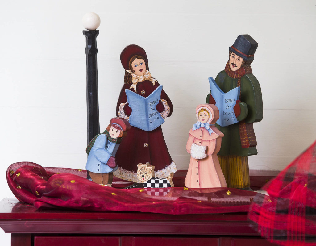 Bill Leese’s parents painted these caroler figurines. (Andy Bronson / The Herald)
