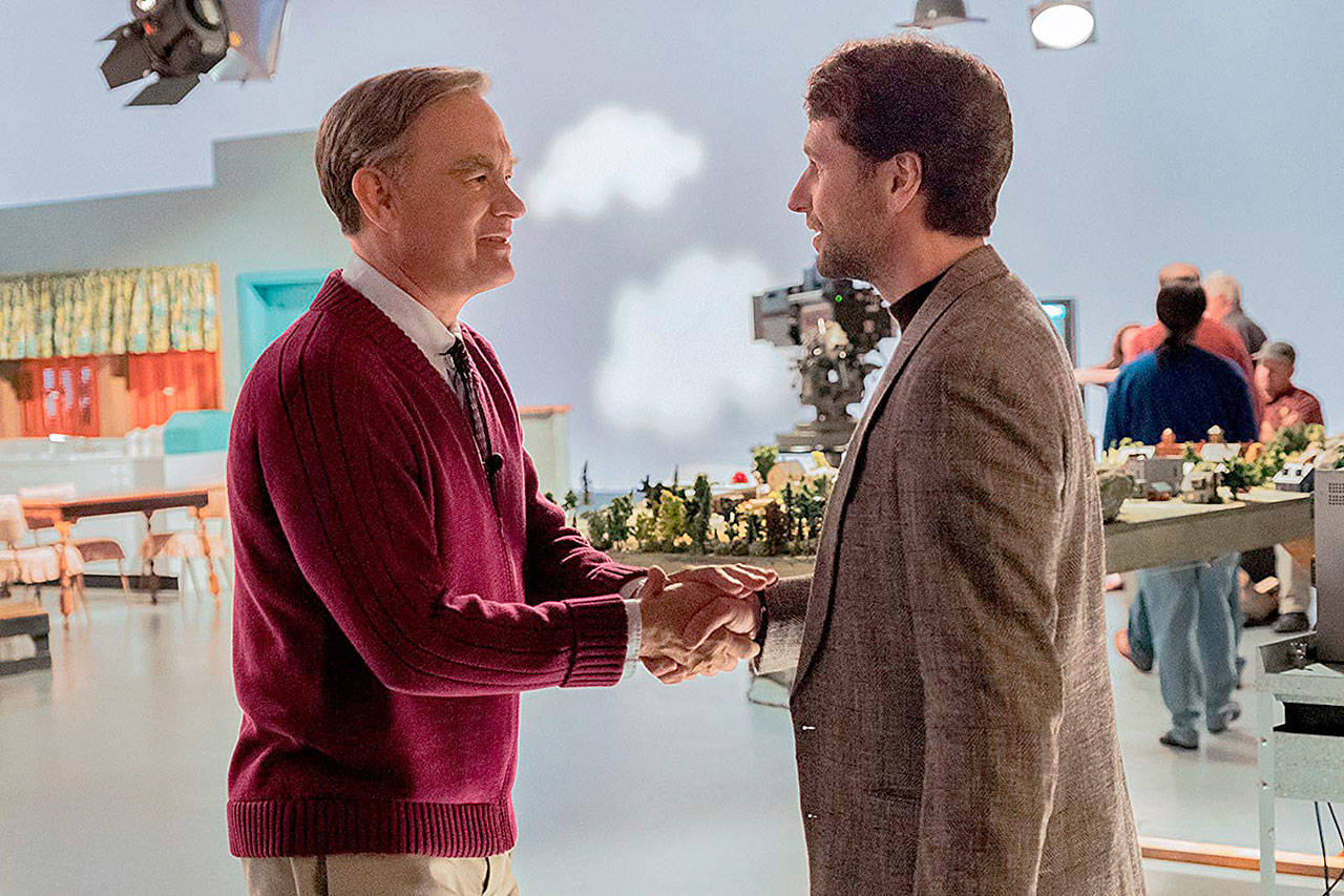 Sony Pictures                                 Saintly television host Fred Rogers (Tom Hanks) meets skeptical journalist Lloyd Vogel (Matthew Rhys) in director Marielle Heller’s biopic, “A Beautiful Day in the Neighborhood.”