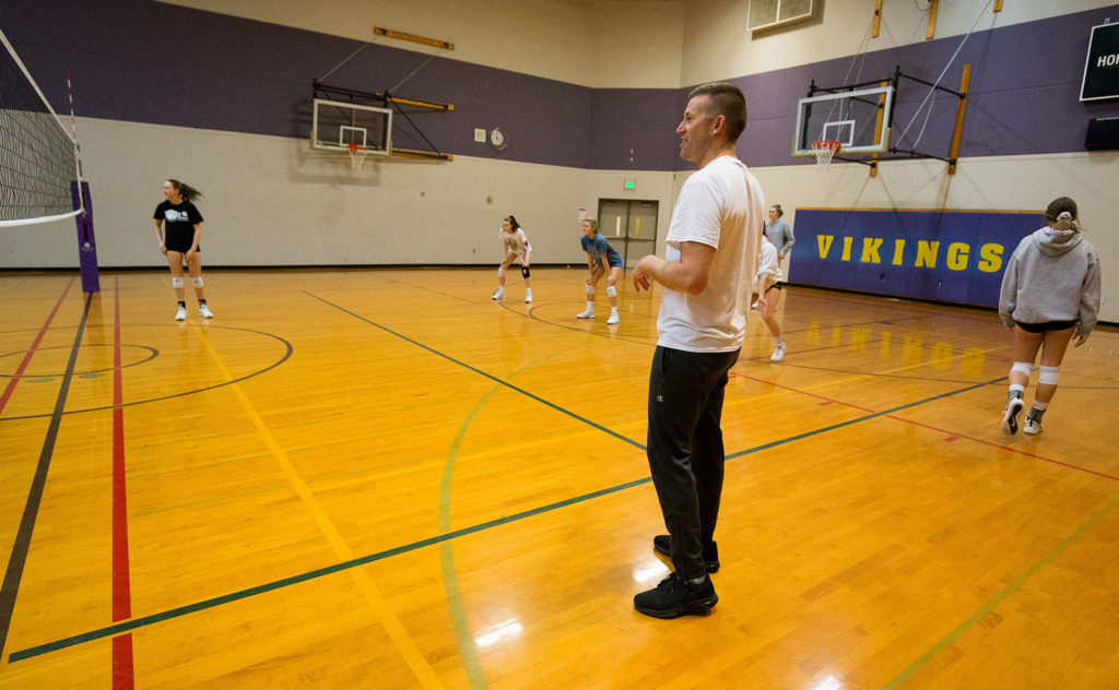 Head coach Kyle Hoglund gets his team set up as the Lake Stevens volleyball team holds its last practice Wednesday before heading to the Class 4A state playoffs. (Andy Bronson / The Herald)
