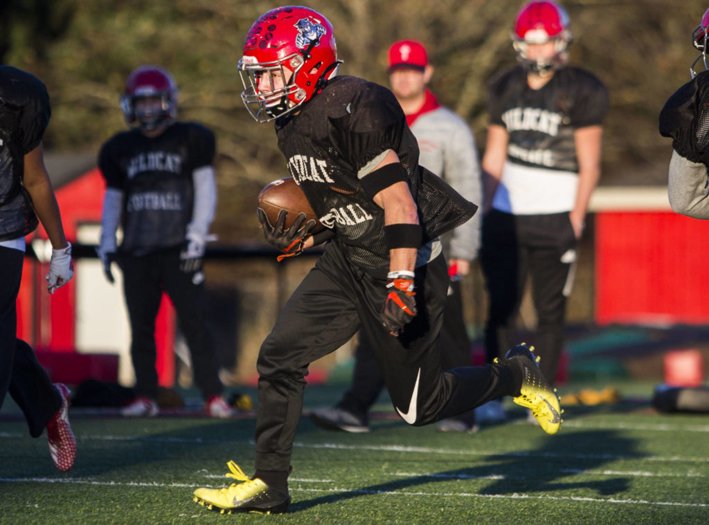 Archbishop Murphy’s Joe Ennis, the grandson of legendary Wildcats coach Terry Ennis, runs the ball during practice on Thursday in Everett. (Olivia Vanni / The Herald)
