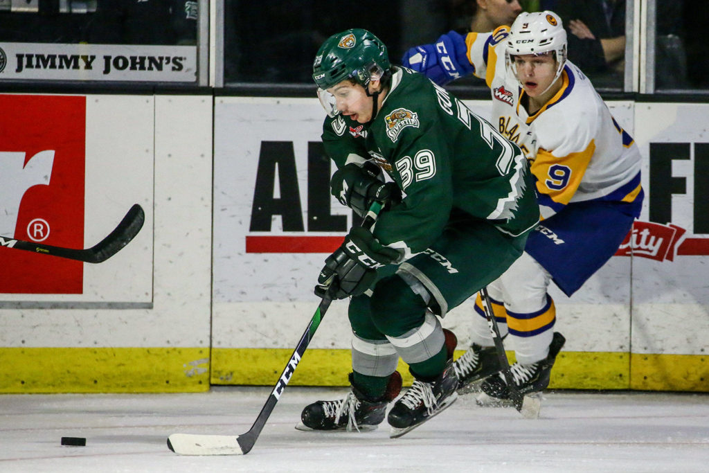 Silvertips’ Gage Goncalves controls the puck with Blades’ Jayden Wiens defending Friday evening at Angel of the Winds Arena in Everett on November 22, 2019. (Kevin Clark / The Herald)
