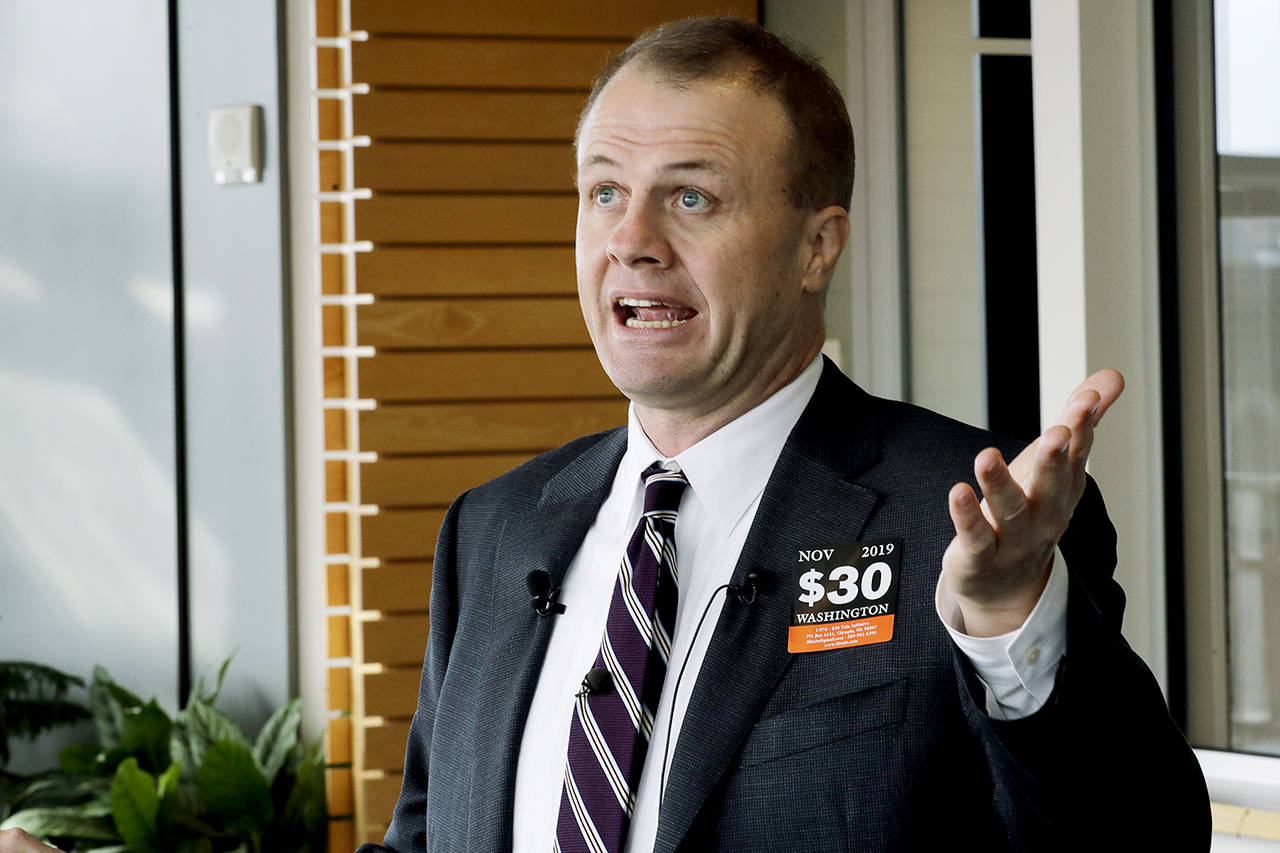 Anti-tax activist Tim Eyman talks to reporters on Nov. 7 outside the office of Seattle Mayor Jenny Durkan in Seattle. (AP Photo/Ted S. Warren, file)