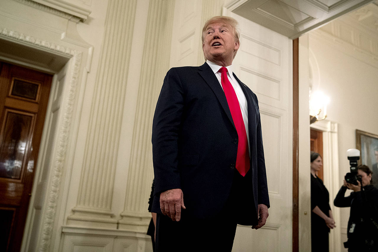 President Donald Trump talks to reporters during NCAA Collegiate National Champions Day at the White House on Friday. (AP Photo/ Evan Vucci)