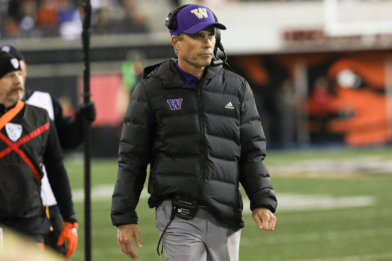 Washington head coach Chris Petersen watches the scoreboard during the first half of a game against Oregon State on Nov. 8 in Corvallis, Ore. (AP Photo/Amanda Loman)