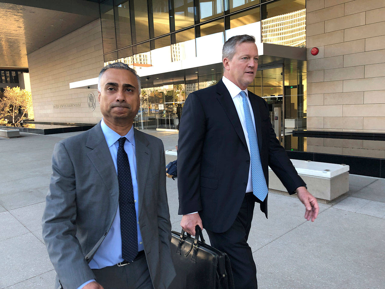 Imaad Zuberi (left) leaves the federal courthouse Friday with his attorney Thomas O’Brien in Los Angeles. Zuberi pleaded guilty to funneling donations from foreigners to U.S. political campaigns. (AP Photo/Brian Melley)