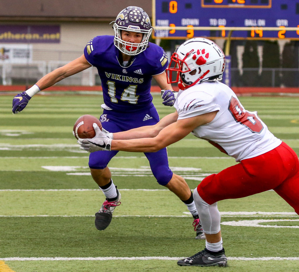 Mount Si’s Stuart DeMerit intercepts a pass intended for Lake Stevens’ Skyler Reyna Saturday afternoon at Lake Stevens High School on November 23, 2019. Lake Stevens lost to Mount Si, 24-22, ending their state championship run. (Kevin Clark / The Herald)
