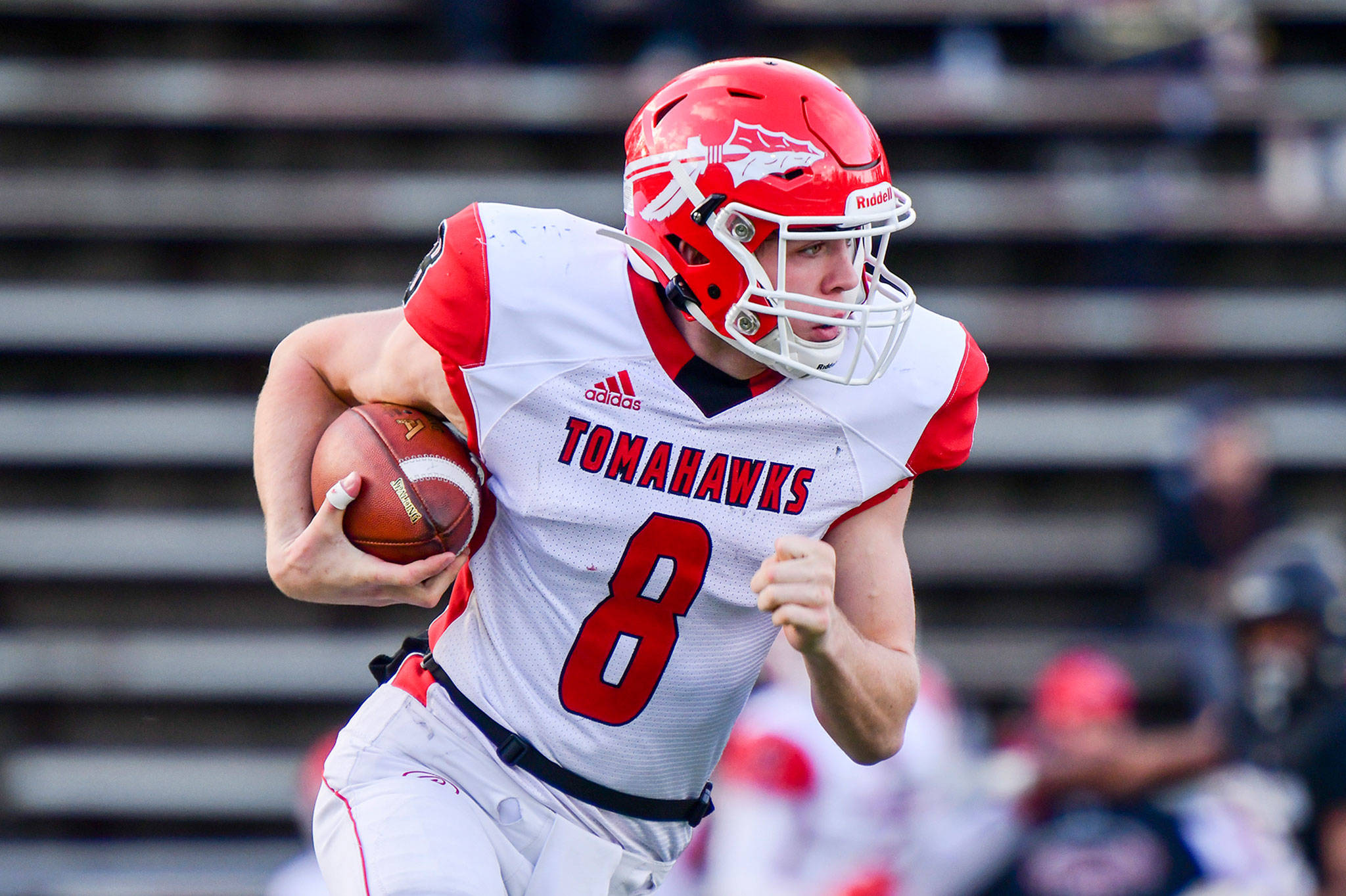 Marysville Pilchuck quarterback Jake Elwood carries the ball during a 3A state quarterfinal against Lincoln on Saturday at the Lincoln Bowl in Tacoma. (Stacy Tyler/Intensity Sports Photography)