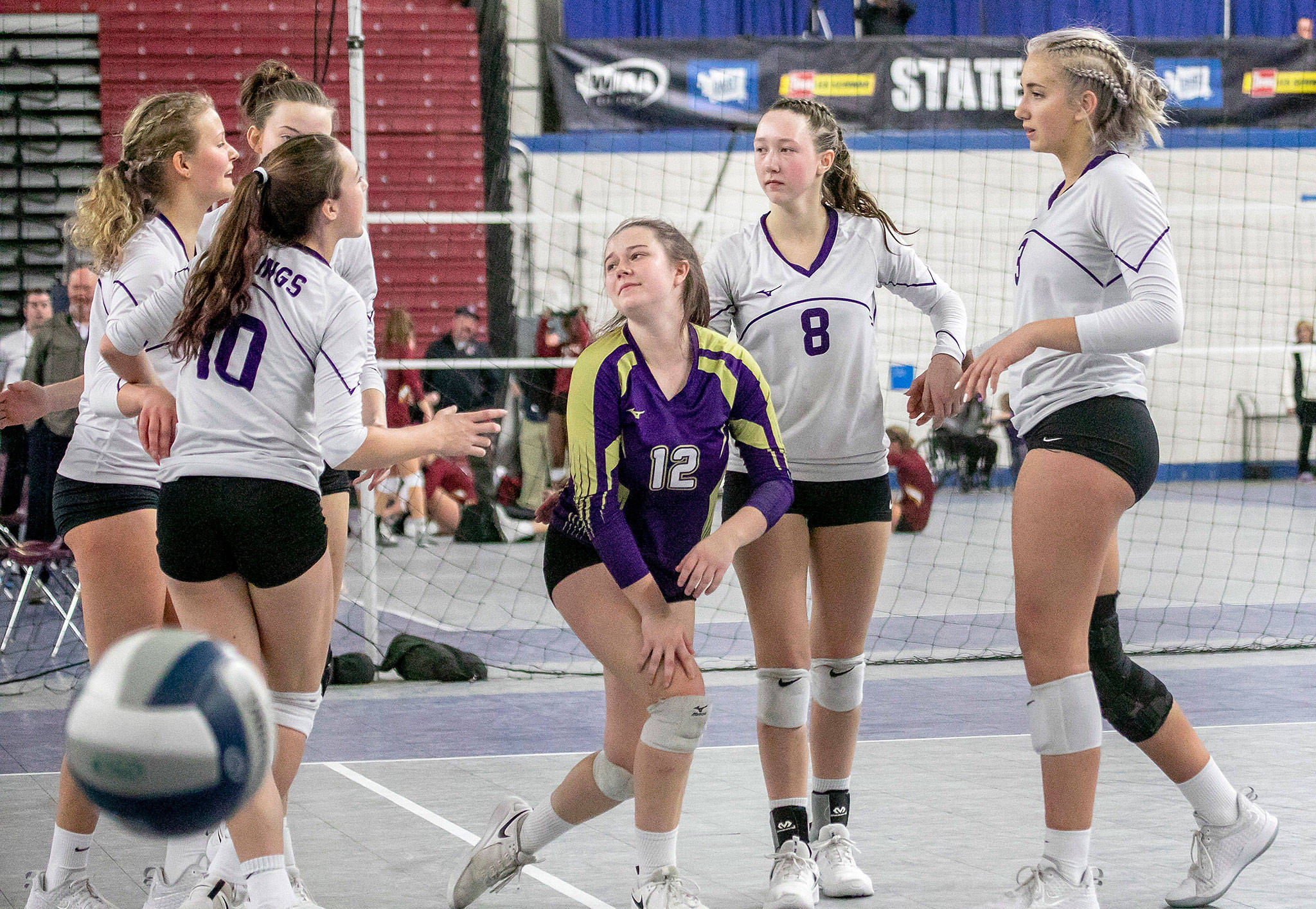 Lake Stevens players react during the Class 4A volleyball state championship match against Tahoma on Saturday night in the Yakima Valley SunDome. The Vikings suffered a four-set loss in their first-ever state final appearance. (TJ Mullinax / for The Herald)