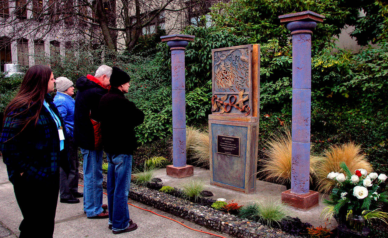 A crowd of about 50 people attended the dedication ceremony for the AIDS Memorial of Snohomish County in December 2005. A World AIDS Day event is scheduled for 2 p.m Sunday at the memorial, located west of the Mission Building on the Snohomish County Campus. (Michael O’Leary / Herald file)