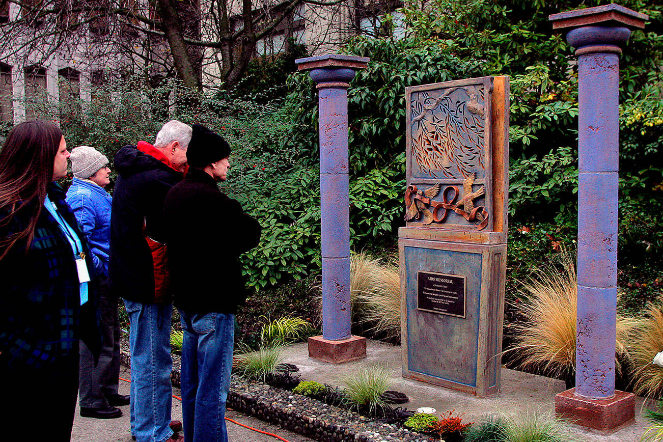 A crowd of about 50 people attended the dedication ceremony for the AIDS Memorial of Snohomish County in December 2005. A World AIDS Day event is scheduled for 2 p.m Sunday at the memorial, located west of the Mission Building on the Snohomish County Campus. (Herald file photo by Michael O’Leary 12/01/05)