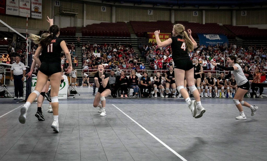 Monroe’s Brooke Barnes (7) celebrates as the Bearcats scores a crucial point during the fifth set against Kentridge at the WIAA State Volleyball tournament November 17, 2018, at the SunDome in Yakima. (TJ Mullinax / For The Herald)
