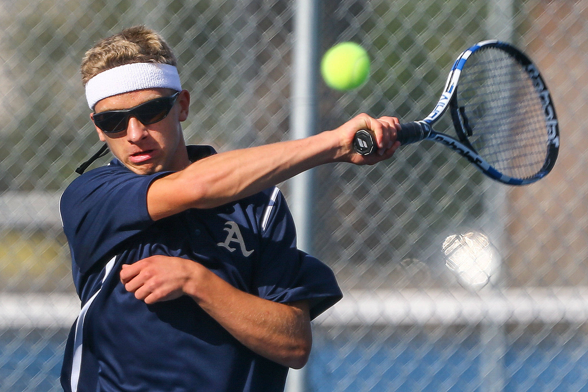 Arlington’s Taras McCurdie returns volley against Everett on Sept. 19 at Clark Park. (Kevin Clark / The Herald)