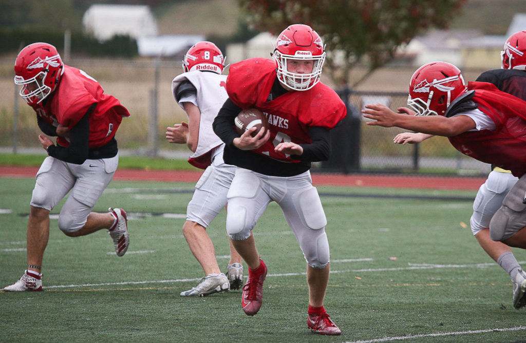 Marysville Pilchuck running back Dylan Carson avoids a tackle during practice on Thursday, Oct. 17, 2019 in Marysville, Wash. (Andy Bronson / The Herald)
