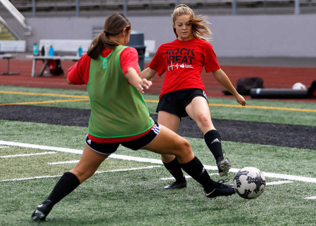 Gracie VanAssche attempts a pass during practice at Snohomish High School on Sept. 7, 2018 in Snohomish, Wa. (Olivia Vanni / The Herald)

