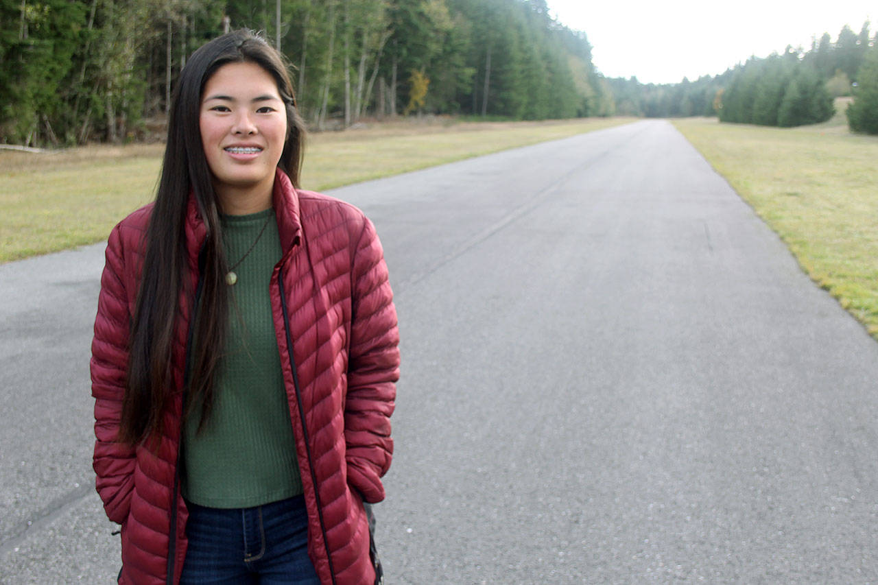 Photo by Kira Erickson / South Whidbey Record                                Arianna Marshall stands on the runway of Whidbey Airpark. One month ago, she raced along it to reach the site of a plane crash.                                Arianna Marshall stands on the runway of Whidbey Airpark. A month ago, she raced along it to reach the site of a plane crash. (Kira Erickson / South Whidbey Record)