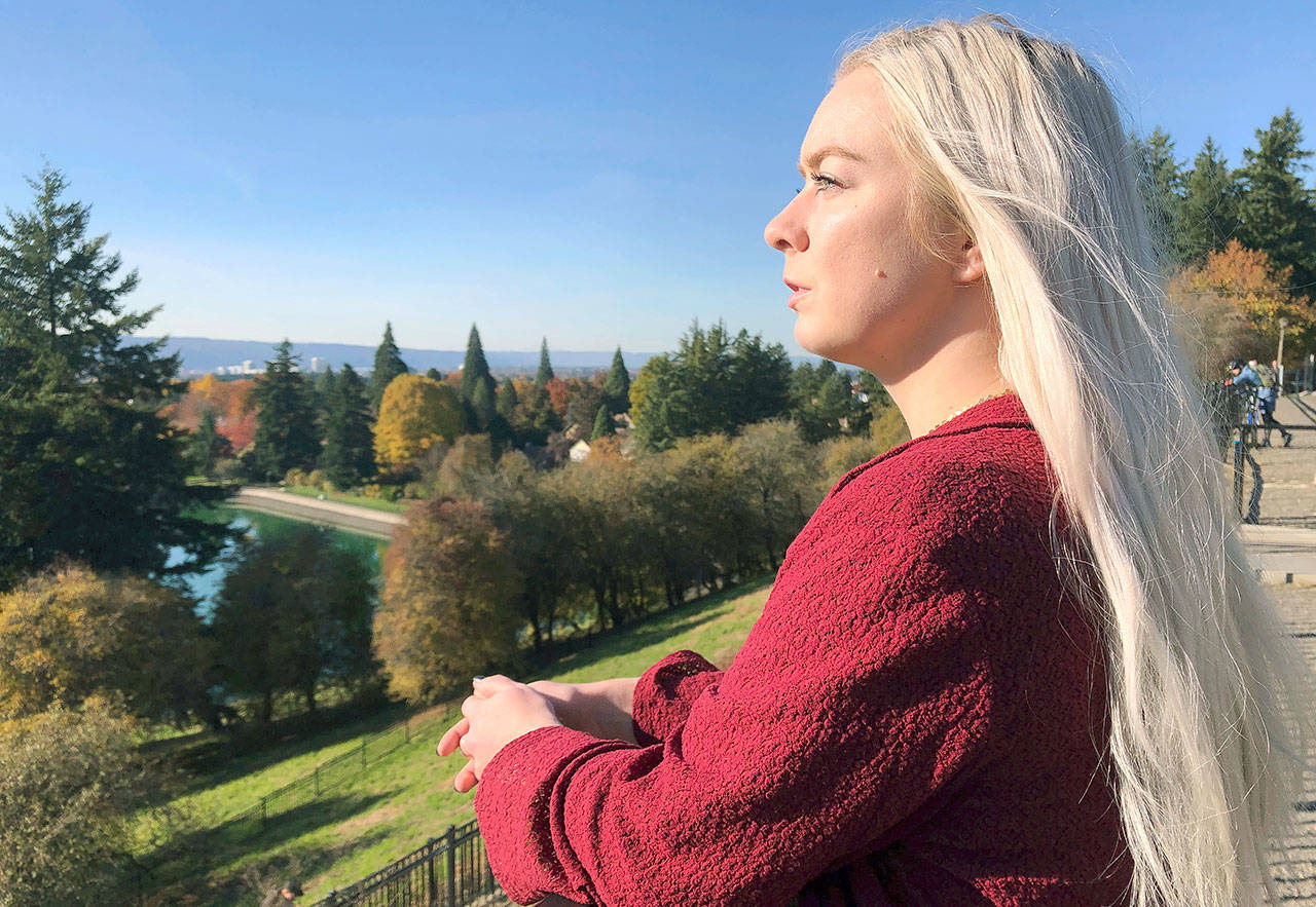 Ashtyn Aure poses for a photo in Portland, Oregon, on Oct. 28. When Aure visited a clinic at Utah Valley University last year, she felt like she was having a breakdown. When she asked to see a counselor, a staff member told her the wait list stretched for months. She left without getting help. (AP Photo/Gillian Flaccus)