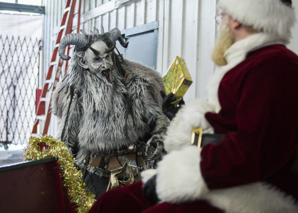 Krampus interacts with Santa Claus at the Oddmall: Emporium of the Weird in Monroe. (Olivia Vanni / The Herald)
