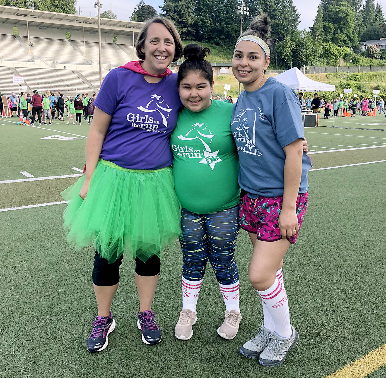 Megan Wolfe (left), executive director of Girls on the Run of Snohomish County, with participant Marlen Mercado-Ayala, 12, and Marlen’s mother, Laura Mercado-Ayala. (Girls on the Run)