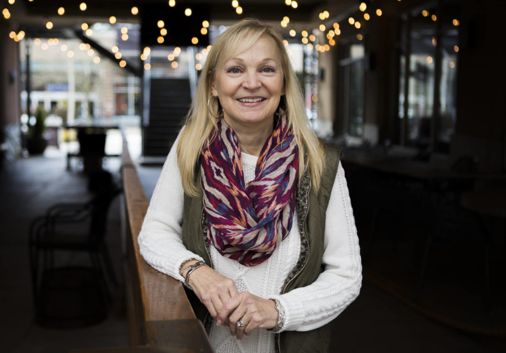 Kelly Howell, 53, of Mill Creek, recently discovered her half-sister Linda Holt through a 23andMe test. Both women share the same biological mother and were adopted at birth by different California families. (Olivia Vanni / The Herald)
