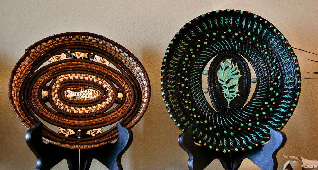 Sooze Sigel’s artwork includes fine basketry she made after taking a class in pine needle weaving at Everett’s Shack Art Center. (Dan Bates / The Herald)
