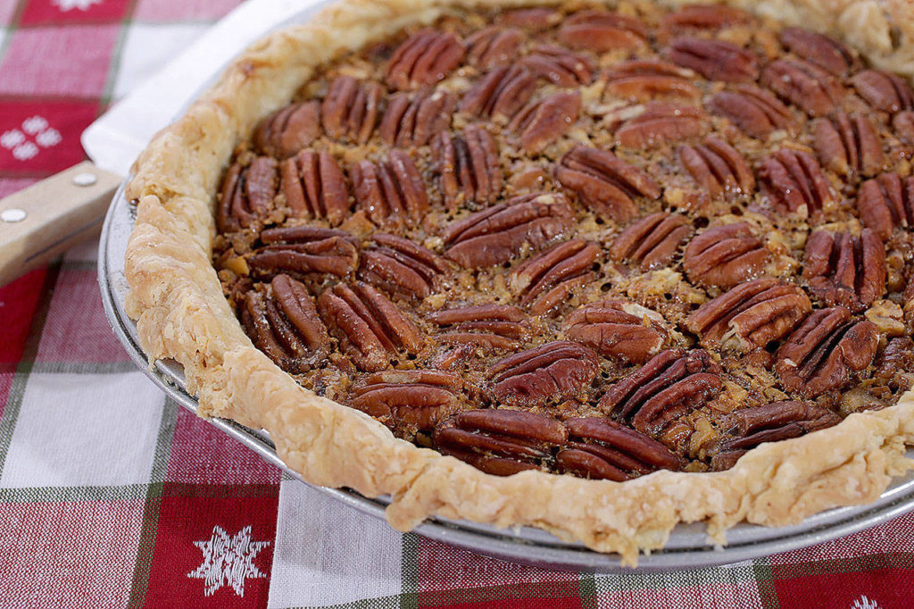 This recipe for pecan pie adds the zest of an orange to balance the sweetness of the pie. (Hillary Levin/St. Louis Post-Dispatch)
