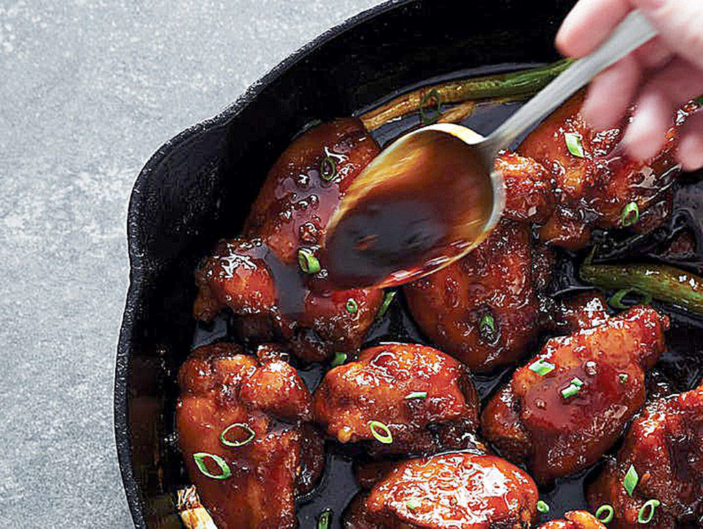 Sticky chicken thighs are marinated in a mixture of honey, soy sauce, garlic and ginger. (Photo by Danielle Atkins)
