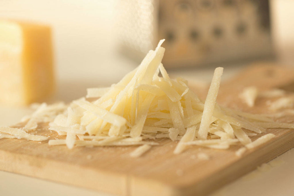 Roast carrot soup with smoked cheese and a rye crumble calls for grated Gouda or cheddar. (Getty Images)
