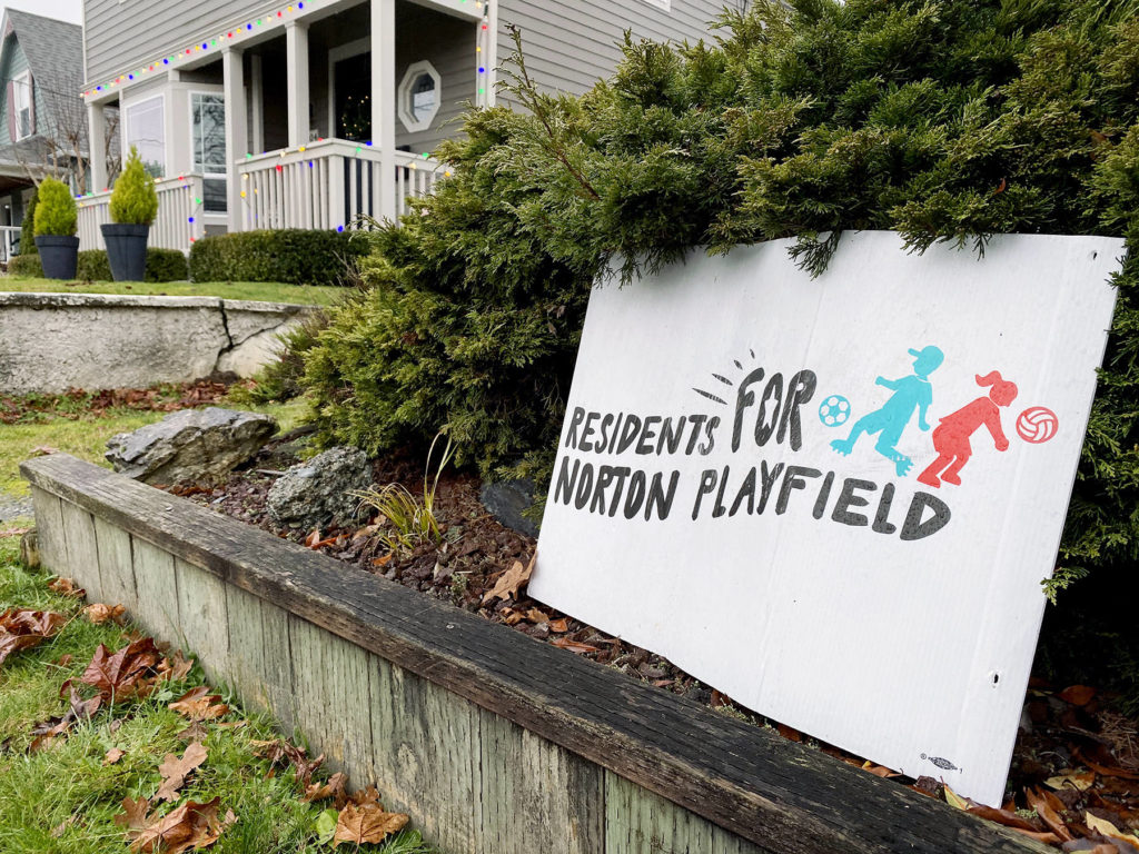 A sign expresses an opinion in front of a home across the street from the Norton Ball Field on Wednesday morning. (Sue Misao / The Herald)
