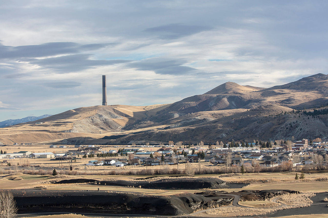 An abandoned smelter chimney, a legacy of what once was the world’s largest copper mining operation, looms over the Anaconda valley in southwest Montana. (Louise Johns / For The Washington Post)